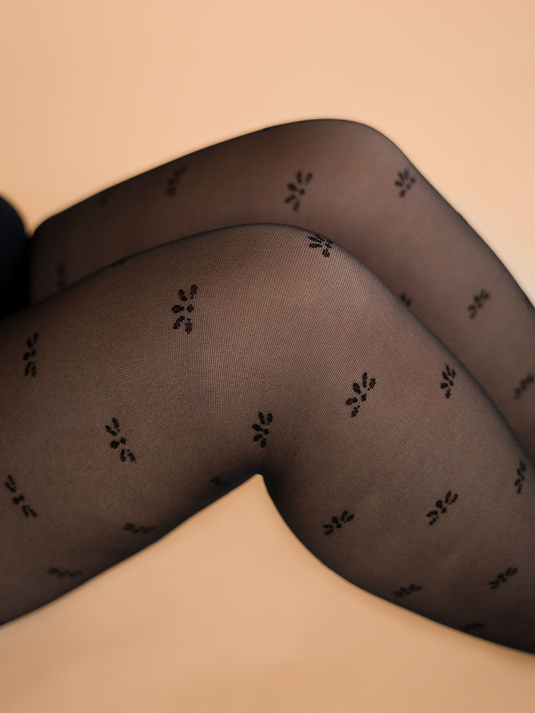 Collants noirs semi-transparents imprimés