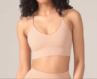 Woman wearing a beige bralette 