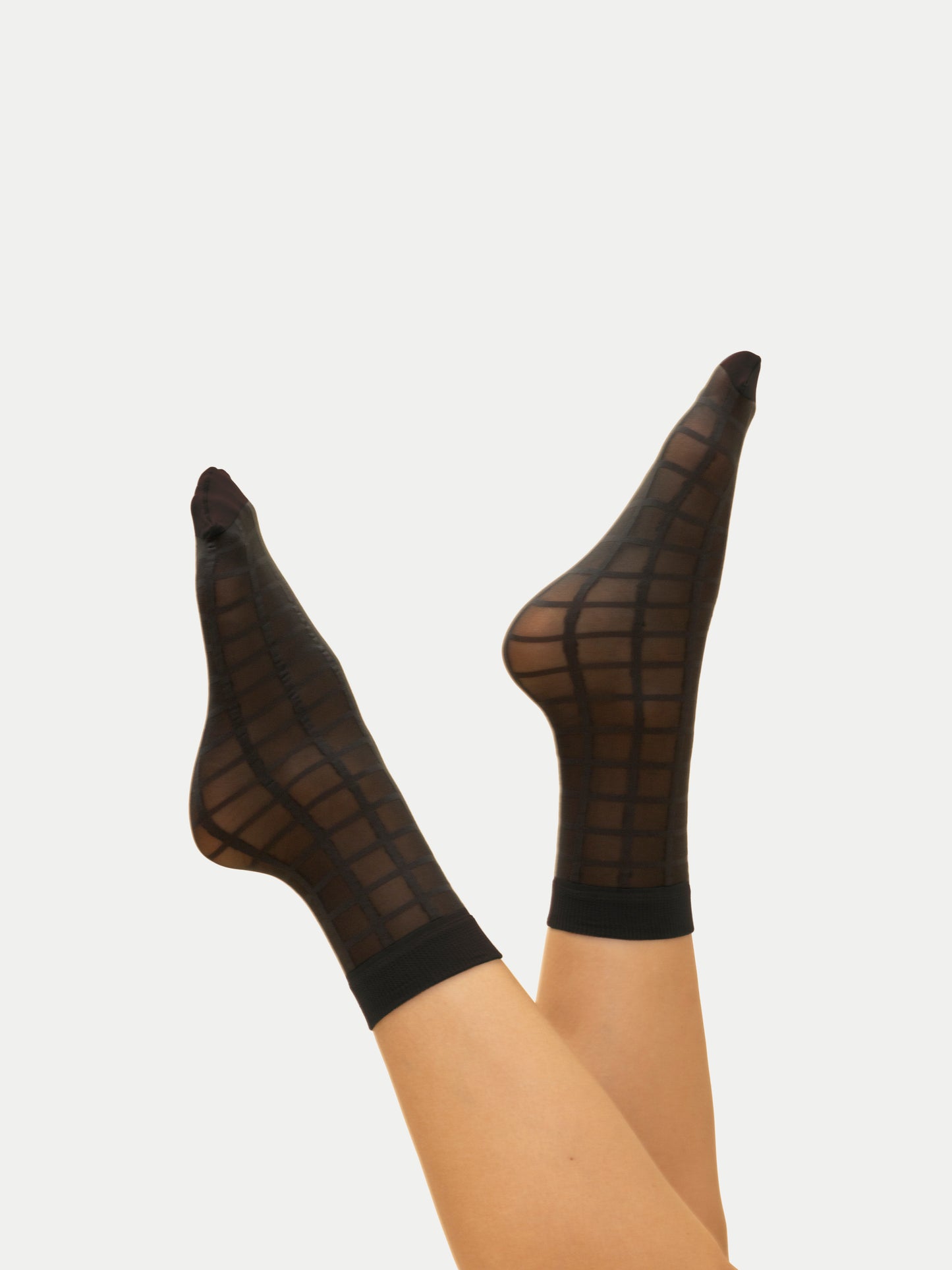 Chaussettes diaphanes à carreaux en Noir