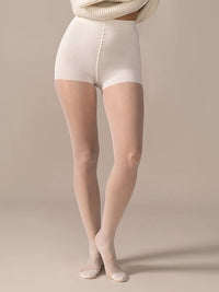Front view close-up of the legs in the Back Vine Sheer Tights in Creamy White with natural smoothing panty.