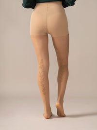 Back view close-up of the legs in the Back Vine Sheer Tights in Dune.