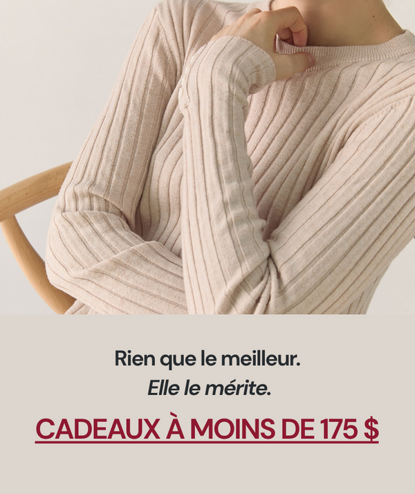 Person wearing a beige ribbed sweater 